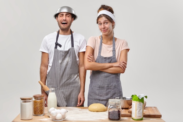 Two cooks smiling in kitchen